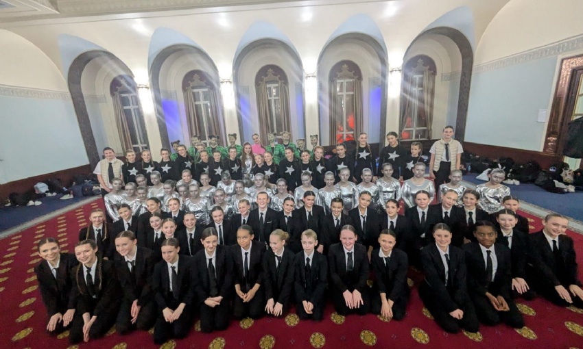 Image shows a group of pupils in costume in a dressing room at Portsmouth Guildhall.